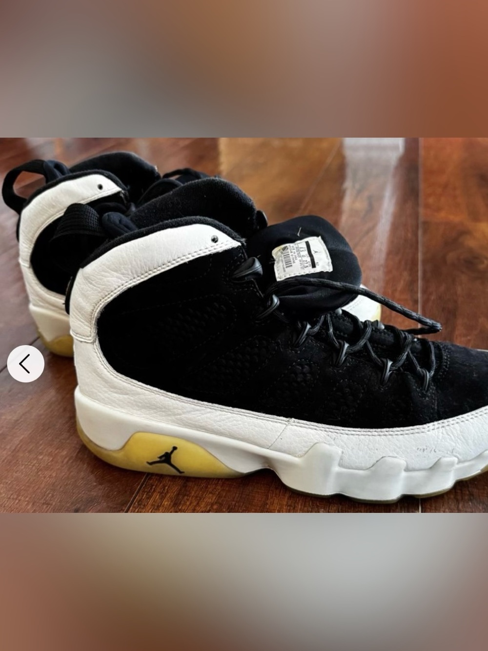 Jordan Men's Black and White High-Top Sneakers with Yellow Sole Accent